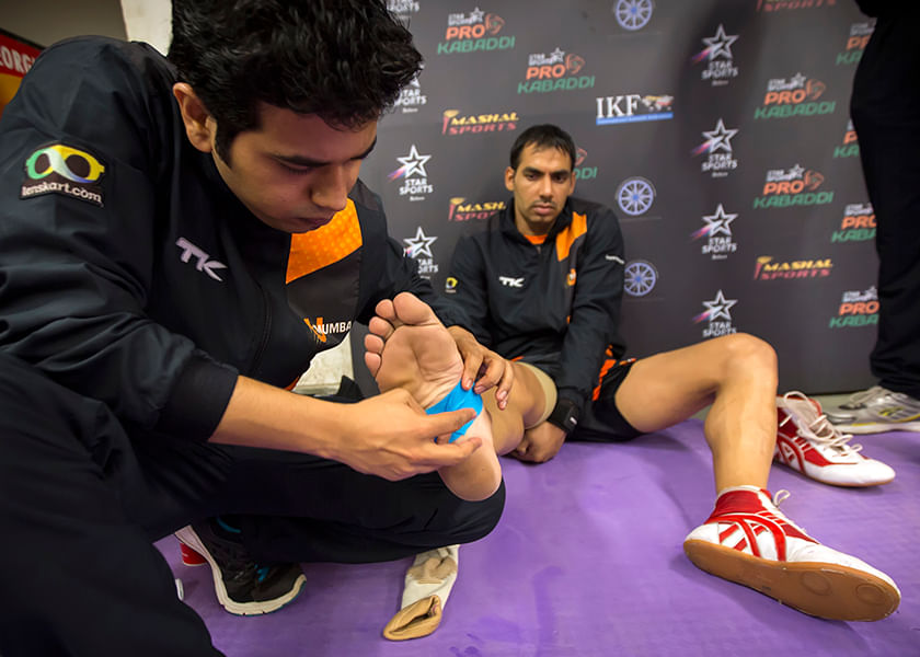Dr Swapnil treating an injured Kabaddi player.